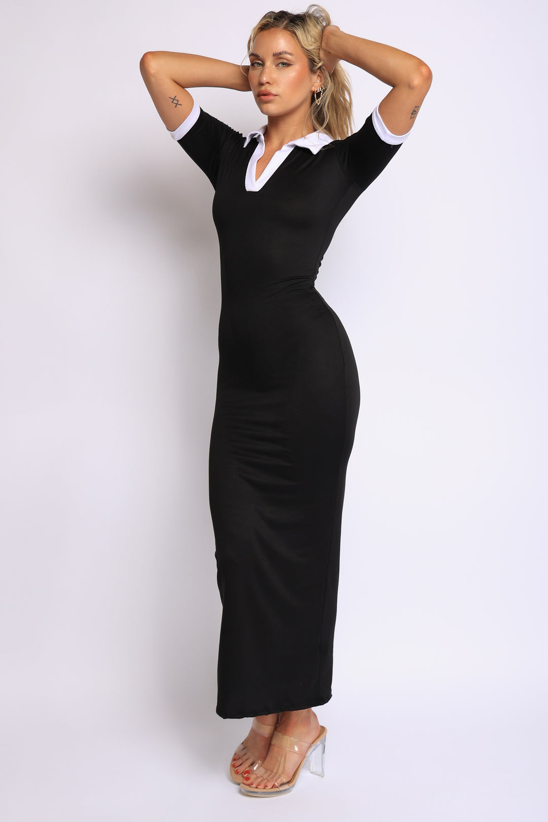 Black bodycon collared dress with white accents, 1/4 left angle for contoured shape display

