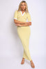 Yellow fitted maxi dress with white collar and sleeve trim, 1/4 left angle showing curve-hugging fit

