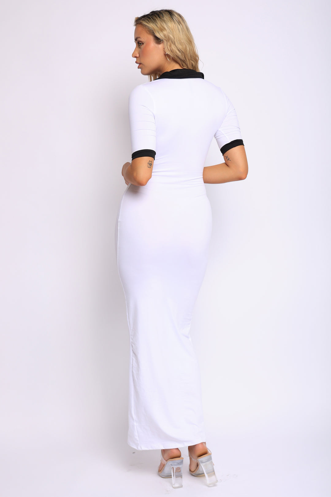 White bodycon maxi dress with black contrast collar and sleeves, front-facing view

