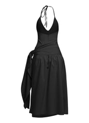 Elegant black halter midi with dramatic leg slit and subtle stretch in woven fabric