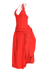 Vibrant red cutout dress with open overlay skirt, plunging neckline, and woven stretch fabric