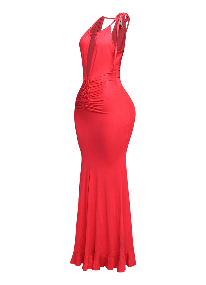Side view of red plunge halter dress showing flared hemline and slim fit


