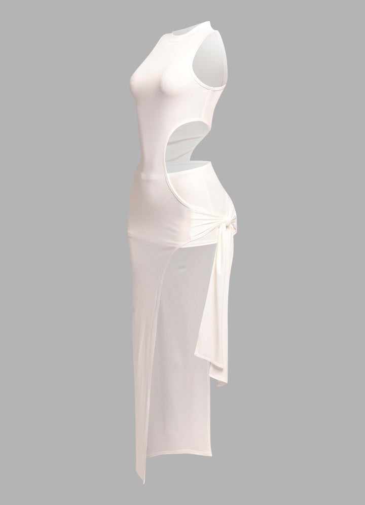 Side view of white sleeveless mock neck dress with hip slit

