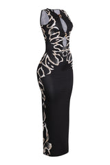 Fitted black maxi dress with tan print accents and bold trim details