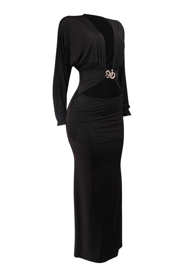 Black dress with a decorative brooch on a white background