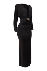 Black dress with a decorative brooch on a white background