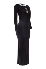 Black evening gown with floral embellishments on a white background