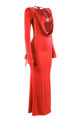 Red evening gown with a decorative brooch on a white background