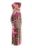 Right angled view of curve-hugging animal print maxi dress with vibrant floral details and flared finish