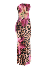 Right angled view of curve-hugging animal print maxi dress with vibrant floral details and flared finish
