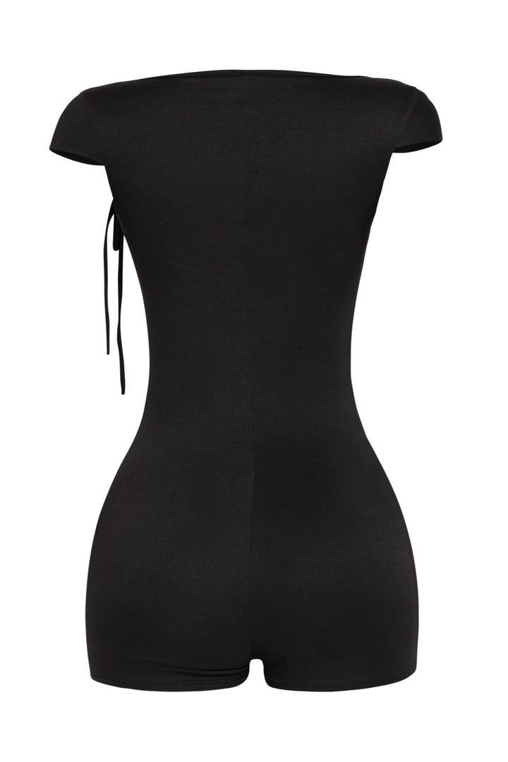 Sleek black romper with square neckline and ruched tie shoulders in summer-ready bodycon cut

