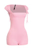 Feminine blush pink romper with curve-skimming shape and flirty square neckline


