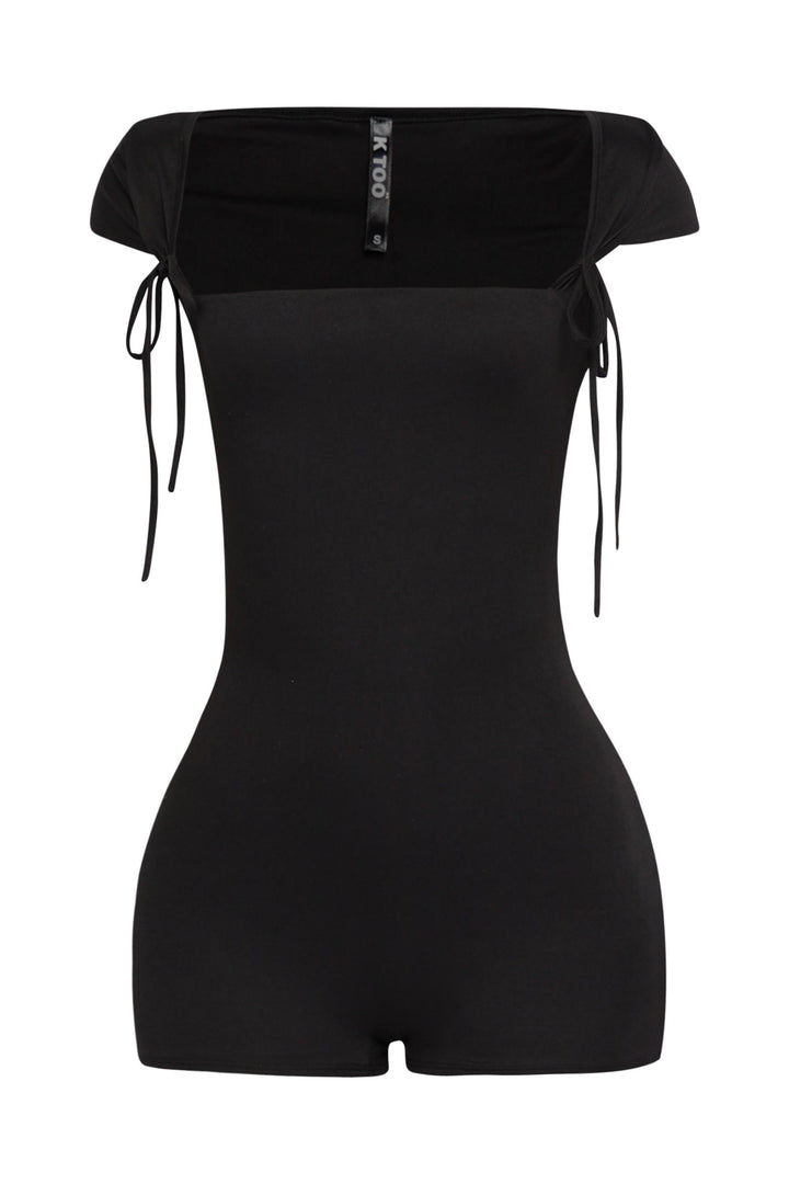 Black cap sleeve romper with tie straps and curve-hugging fit in glossy stretch fabric

