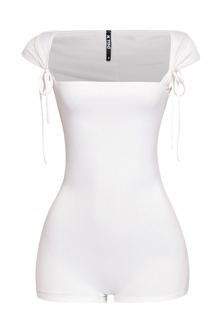 White cap sleeve romper with wide neckline and dainty shoulder tie details in bodycon fit

