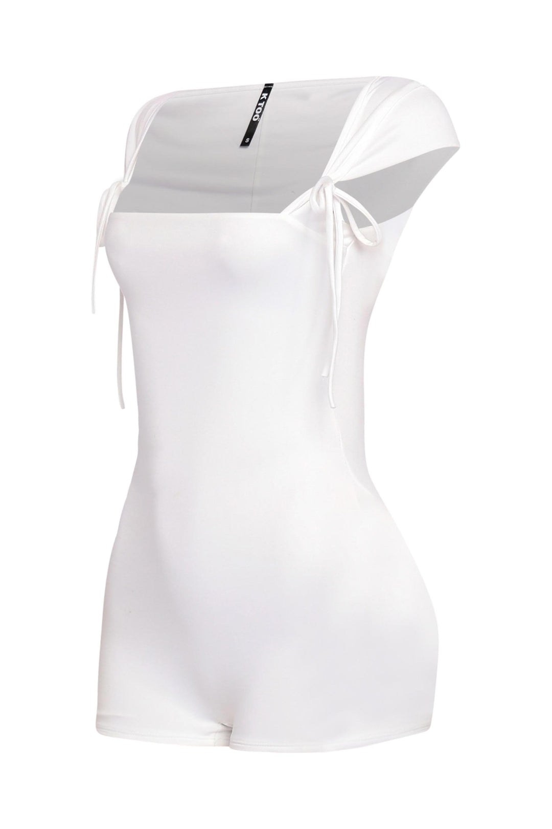 Side profile of white fitted romper with clean design and tied straps at shoulders

