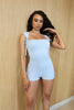 Baby blue romper with cap sleeves and tie-up details at shoulders in pastel summer hue

