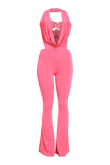 Hot pink deep cowl halter jumpsuit with heart trim and dramatic flared legs

