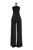 Black evening jumpsuit with flared leg and cutout trim neckline