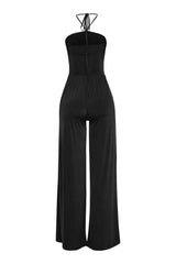 Black evening jumpsuit with flared leg and cutout trim neckline