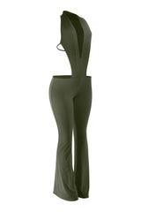 Green jumpsuit with cut-out design on a white background