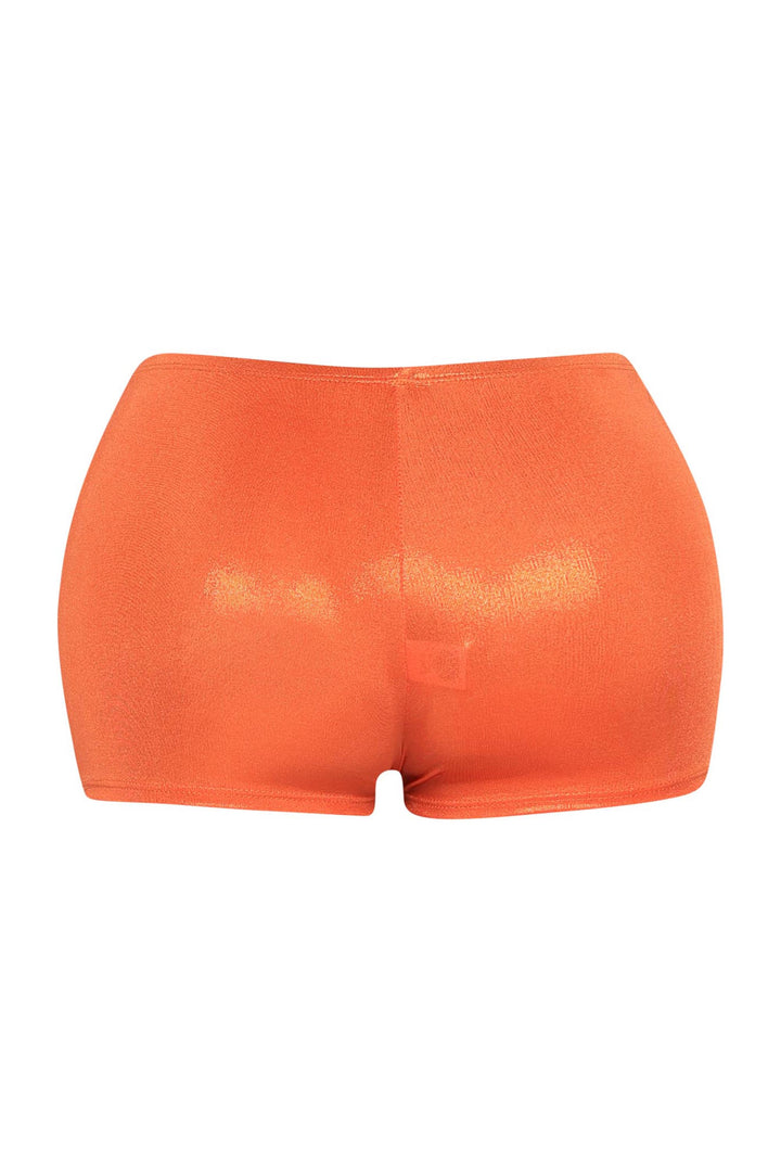 Bold orange short shorts with second-skin fit and sleek hemline