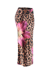 Right angled view of bold print flared maxi skirt featuring tropical pink flower and animal print