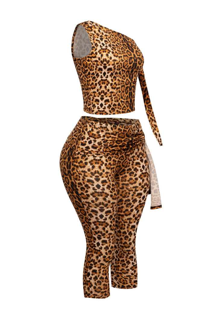 Animal print capri outfit featuring one-shoulder top with draped tie and body-hugging bottoms

