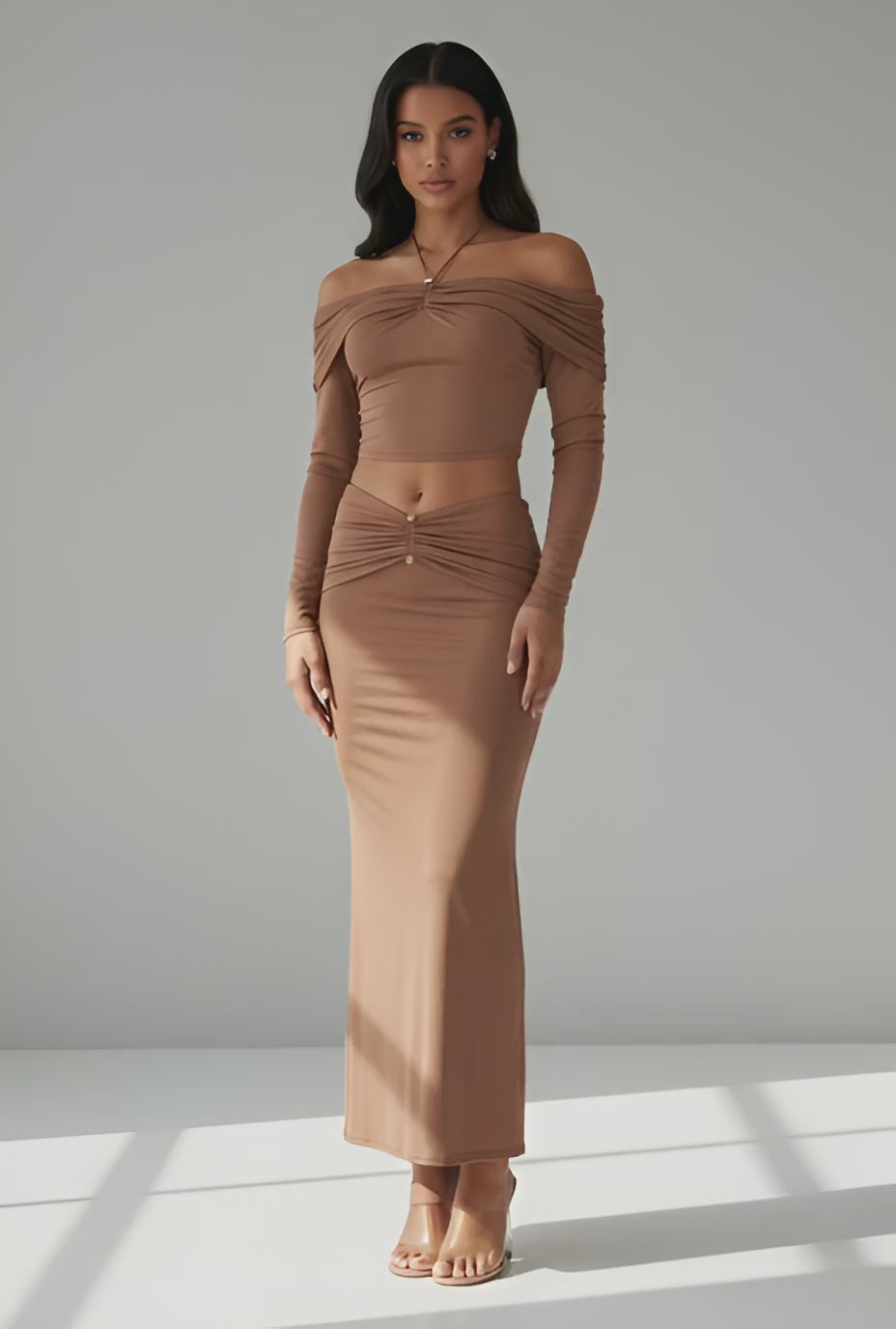 Brown two-piece set with mock neck crop top and flared maxi skirt front view