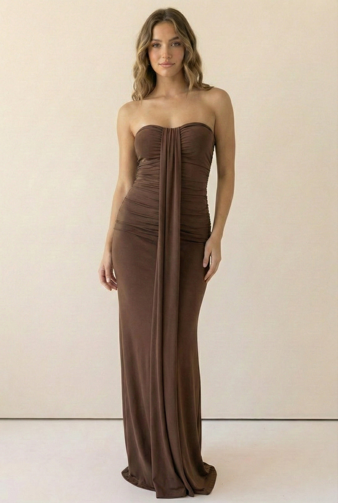 Brown strapless maxi dress with ruched detailing and front drape panel in soft stretch fabric; body-skimming fit for going-out or dinner looks