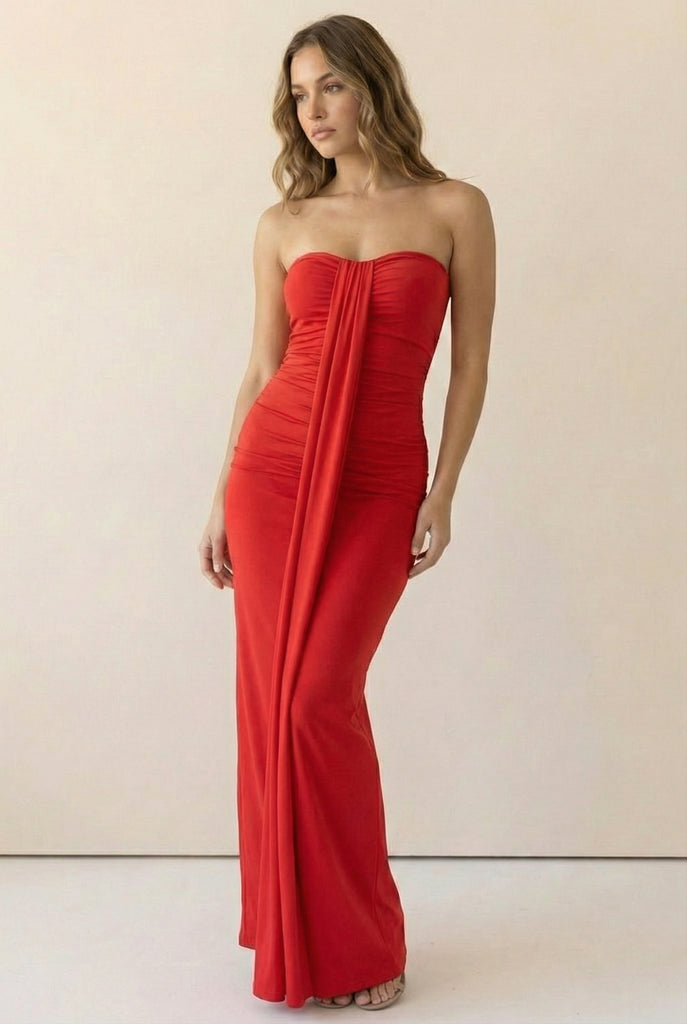 Ruched red strapless maxi with draped front panel and sleek stretch fit; flattering body-hugging silhouette for date night and vacation style