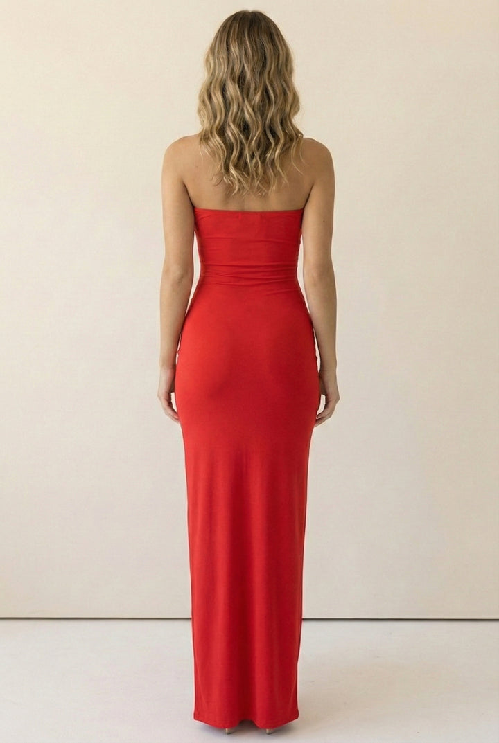 Back view of red strapless bodycon maxi dress in smooth stretch fabric with clean finish and curve-accentuating fit for going-out looks