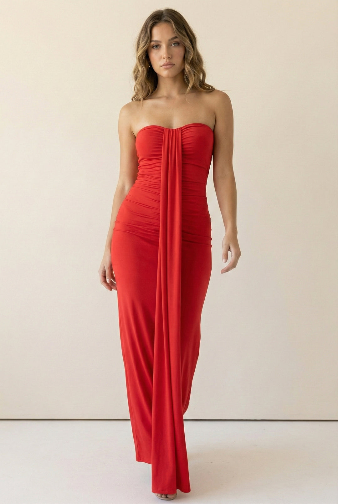 Red strapless maxi dress with soft front drape and ruched bodice in stretch fabric