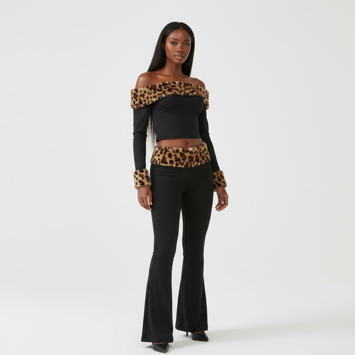 Woman wearing a black outfit with leopard print accents on a white background