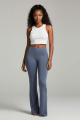 Front view of slate blue high rise pants with wide flare hem and sleek finish