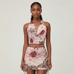 Woman wearing a floral two-piece outfit on a plain background