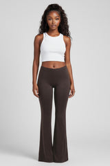 Front view of chocolate brown flare pants with high waist and clean leg line