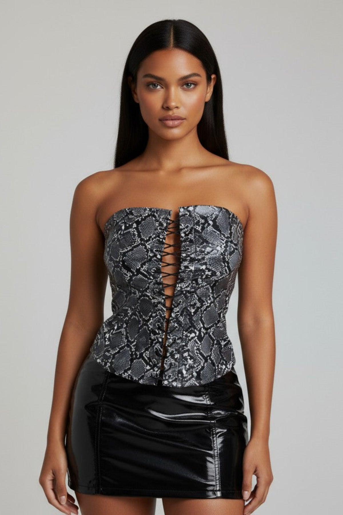 Front view of black and grey snake print tube top with lace-up detailing