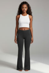 Front view of black flared pants with smooth waistband and figure-hugging shape